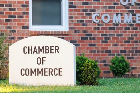 "Camber of commerce sign outside building, horizontal."